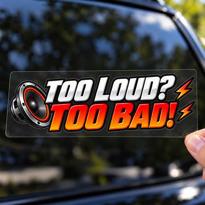 Ръка държи цветен стикер TOO LOUD? TOO BAD! върху плоско прозрачно транспортно фолио
